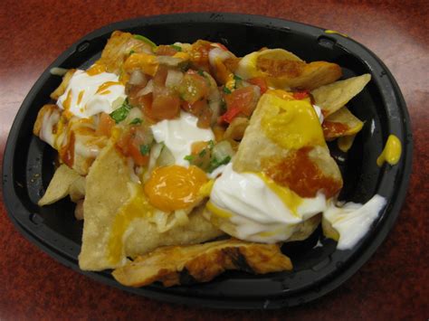 Taco bell's nachos party pack is their latest order of nachos so far and features tortilla chips topped with seasoned beef, warm nacho cheese the nachos party pack is roughly about twice the size of the $5 nachos grande box that they offered last year. Fully Loaded Cheesy Volcano Chicken Nachos from Taco Bell ...