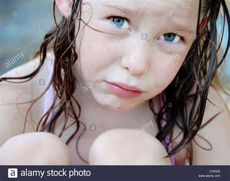 Freckle Faced Cute Girl Looking Sad Or Unhappy Stock Photo