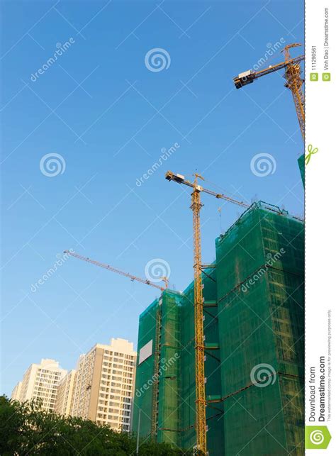 Under Construction Building With Finished Built Buildings Stock Image
