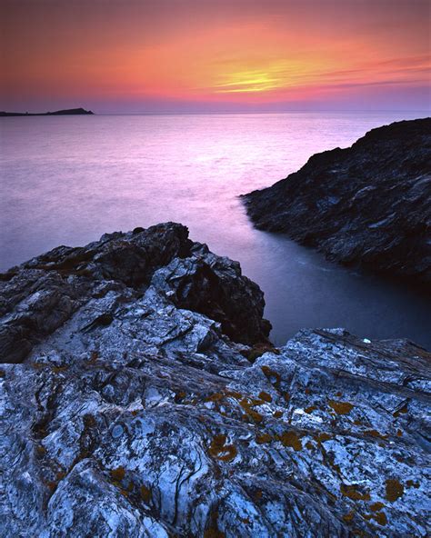 Sunset By The Cliffs Of Newquay In Cornwall England