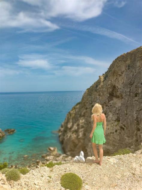 Beauty Blonde Woman In Green Dress On Her Way To Dreamy Beach On Rhodes