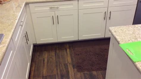 Check to make sure cabinet is plumb. FLOATING KITCHEN FLOORING INSTALLATION LAMINATE WOOD ...