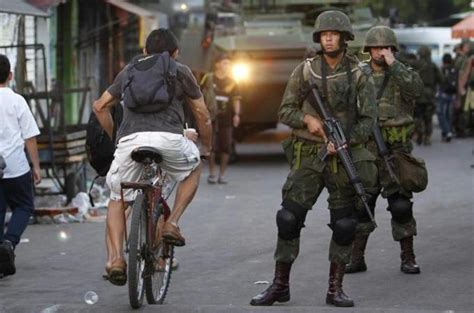 Brazil Army Occupies Slums Ahead Of World Cup News Al Jazeera