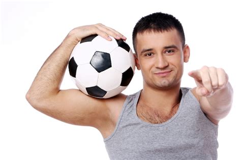 Attractive Guy Holding Soccer Ball Free Photo