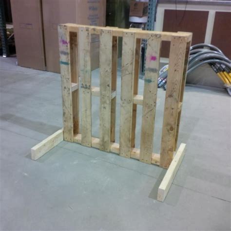 Beginning at one end, mark the locations for (13) 2x4s on the 4x4s. a simple pallet bike rack that i made at work. | Diy bike ...