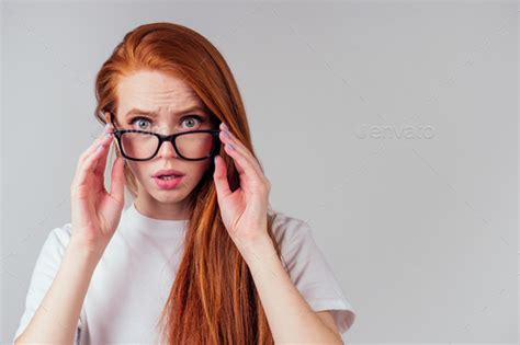Redhaired Ginger Woman Wearing Glasses And White Cotton Eco T Shirt In