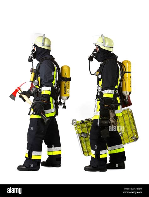 Fire Men With Breathing Apparatus And Fire Fighting Equipment Fire