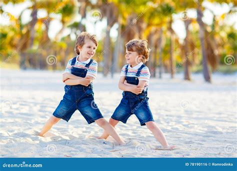 Two Little Kids Boys Having Fun On Tropical Beach Stock Photo Image