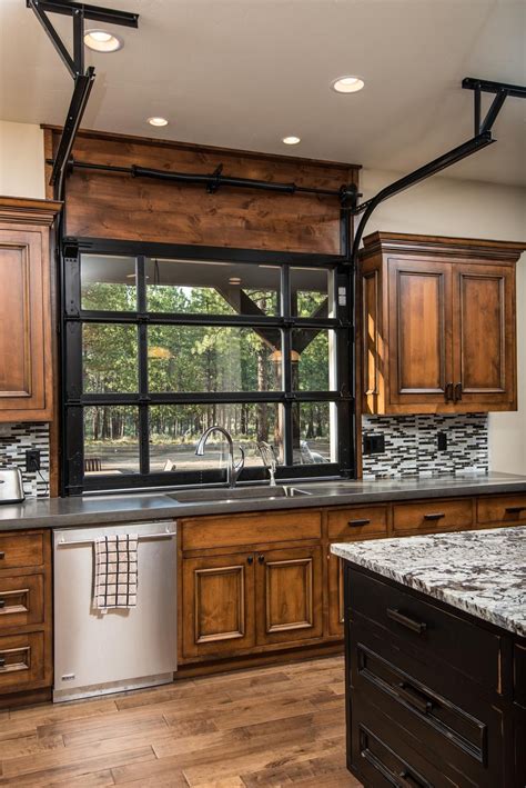 Wooden garage doors, stained and finished with a clear coat of polyurethane, allow this home's country character to shine through. Custom Homes Photo Gallery - Custom Home Builders in Bend ...