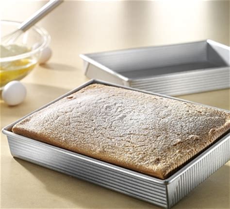 For round cake pans it's just πr²h (π x square of radius x height), for square and rectangular cake pans it's lbh (length x breadth x height). 9" X 13" RECTANGULAR CAKE PAN-USAPAN-1110RC