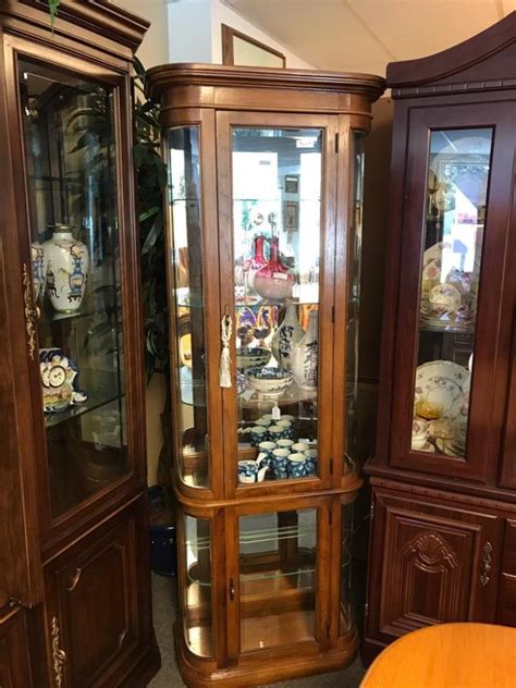 They come in many forms, from tall to short, cylindrical to rectangular, but all are meant to display and accent whatever you decide to put into them. Sold Price: Light oak modern lighted curio cabinet wit ...