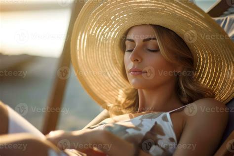 A Close Up Shot Of A Woman In A Bikini Lying Comfortably On A Beach Lounger Basking In The
