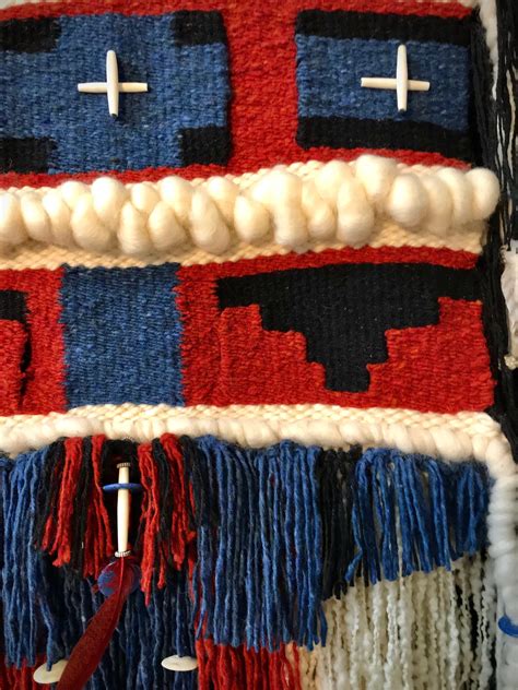native american style geometric weaving with feathers and beads navaho influenced handwoven