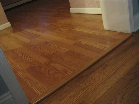 This strip is for tile flooring to laminate transitions, and generally the strip will match the laminate floor covering. Installing Strip Of Laminate Flooring Transition - Loccie ...