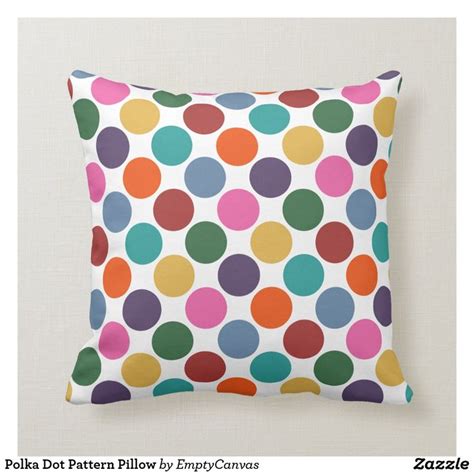 A Colorful Polka Dot Pattern Pillow On A White Background With The