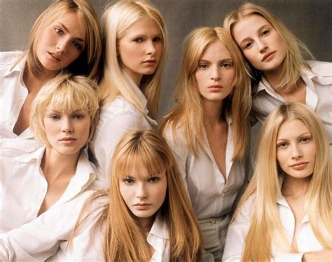 The Blond Women Are Posing Together For A Photo