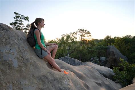 Sportswoman Sitting Alone Taking A Break On Hillside Trail Female Hiker Enjoying View Of