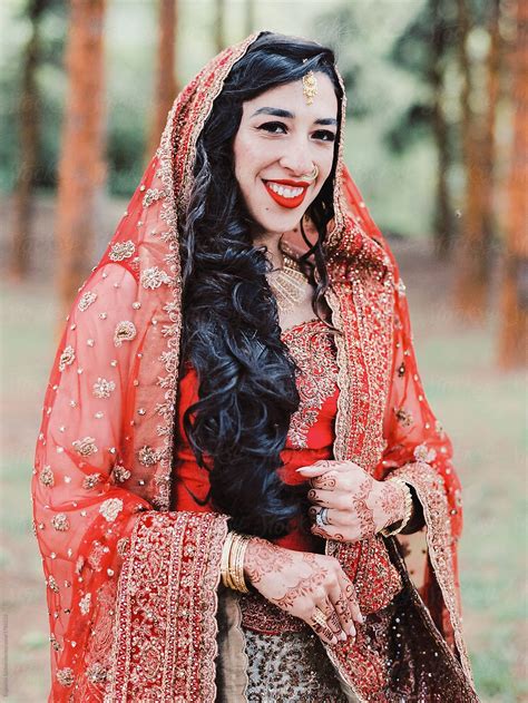 Portrait Of An Indian Bride Wearing Traditional Wedding Sari By