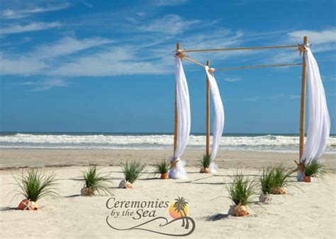 Four Post Bamboo Wedding Arch White Linens Starfish And Shells Wedding