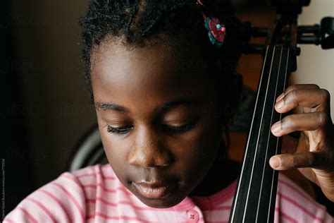 African American Girl Playing Cello Del Colaborador De Stocksy Gabi