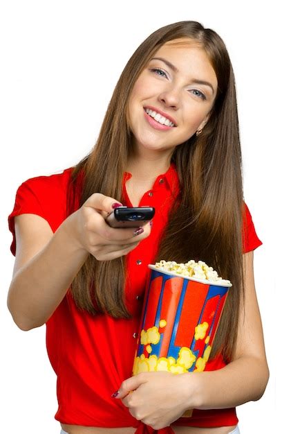 Premium Photo Girl Eating Popcorn And Watching Tv