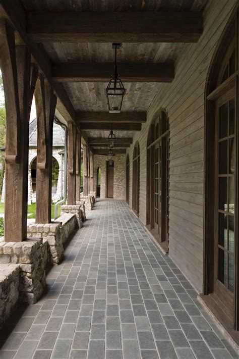 52 best brown brick houses images | house styles, exterior design, house design. Brown wood columns coordinate with exposed wood beams on ...