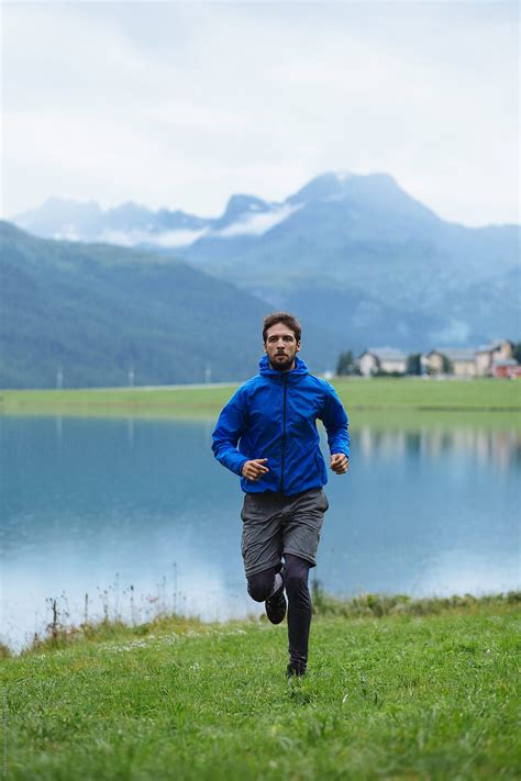 Man Running Near The Lake Del Colaborador De Stocksy Marko Stocksy