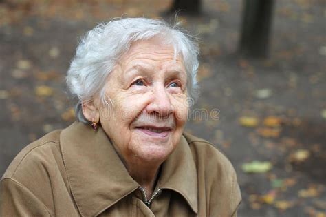 Portrait Of The Old Woman On A Autumn Background Affiliate Woman