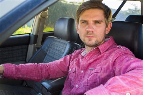 Handsome Young Man In A Shirt Driving A Car Stock Photo Image Of