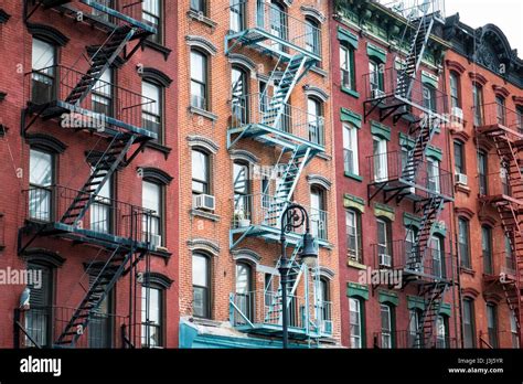 Red Brick Apartment Building With Fire Escape In New York City Stock