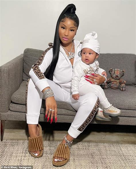Nicki Minaj Cradles Nine Month Old Son Papa Bear As The Duo Sport Matching Designer Tracksuits
