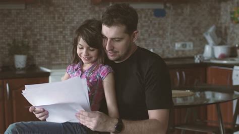 Daughter Sits On Her Fathers Lap วิดีโอสต็อก ปลอดค่าลิขสิทธิ์ 100 25773800 Shutterstock