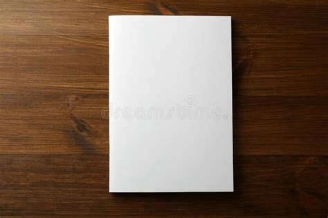 Blank Paper Brochure On Wooden Table Top View Mockup For Design Stock