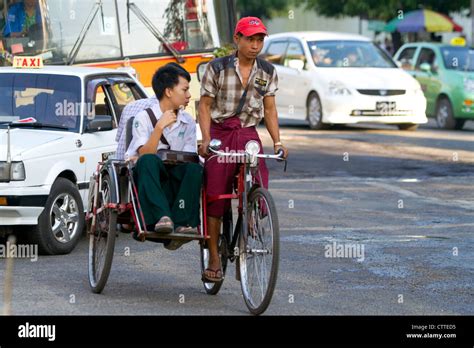 Passengers Riding In A Trishaw In Rangoon Yangon Burma Myanmar