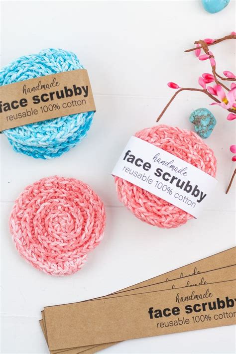 Three Crocheted Scrubbys Are Sitting On A Table Next To Some Cotton