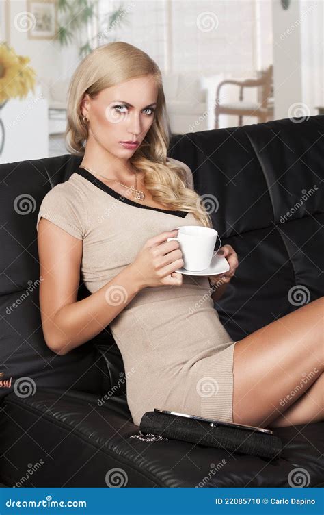 Sitting On Sofa Drinking From A Cup Stock Photo Image Of Beautiful