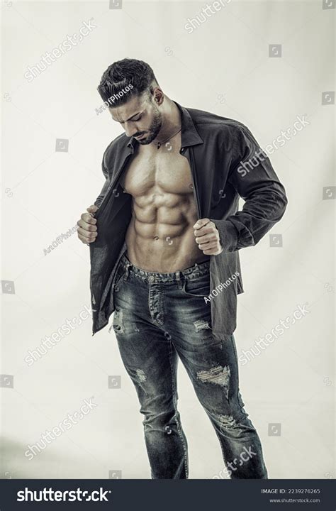 Muscular Bodybuilder Undressing Opening Shirt On Stock Photo 2239276265