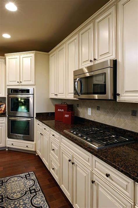 White Kitchen Cabinets With Baltic Brown Granite