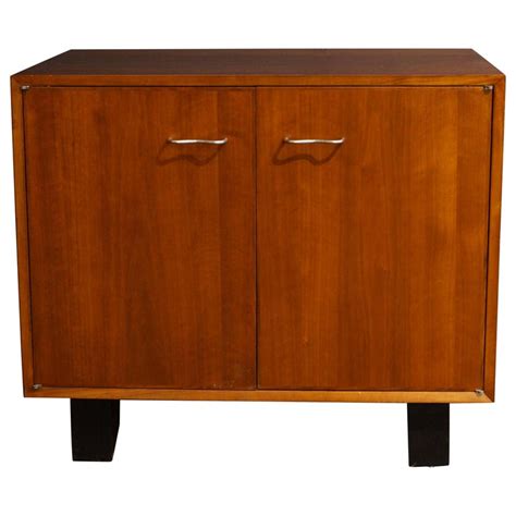 And described below to be free from defects in materials and workmanship for a period of 10 years. George Nelson Herman Miller Cabinet For Sale at 1stdibs