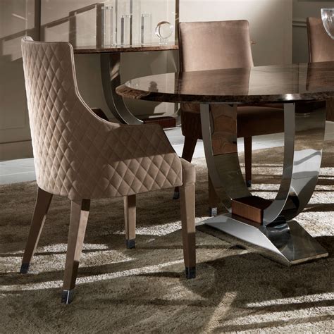 Featuring a stylish, curved, polished chrome base and a luxurious marble top that perfectly accompany. Oval High End Marble Italian Dining Table Set