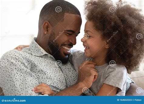 happy biracial dad and daughter have fun at home stock image image of candid excited 164652223