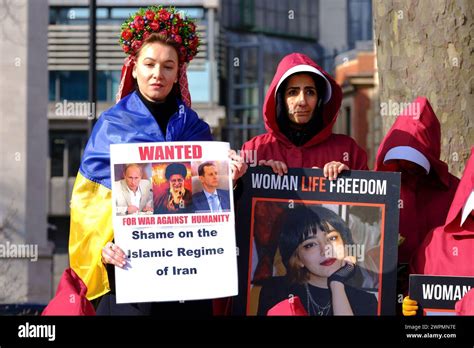 London, UK, 8th March, 2024. British-Iranians dressed in handmaids tale