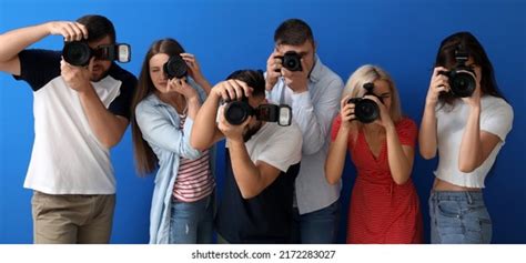 Group Young Photographers On Blue Background Stock Photo 2172283027