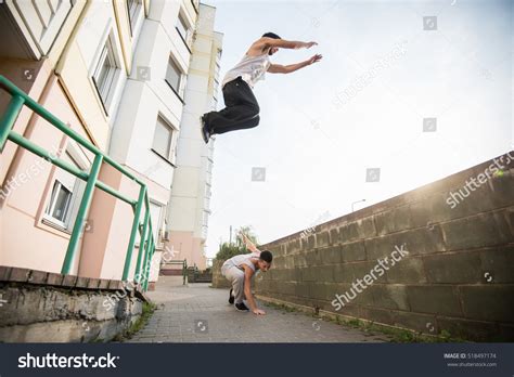 Teenagers Paired Training Parkour Jump Urban Stock Photo Edit Now
