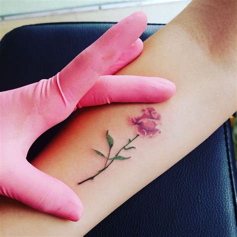 The next tattoo idea is just stunning. Super cute micro rose tattoo by sam! | Rose tattoos, Tiny ...