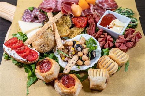 Mixed Antipasto Platter With Cold Cuts And Legumes And Cheeses Stock