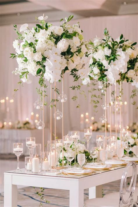 Glamorous Tall Centerpieces With White Roses Carnations And Orchids White Floral Centerpieces