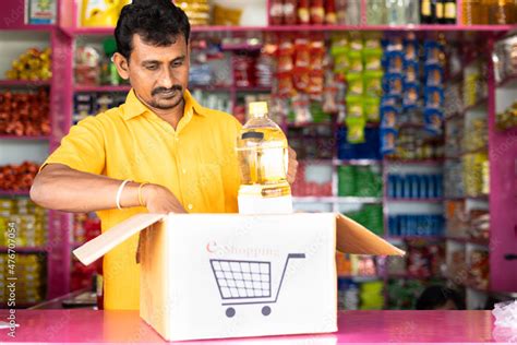 Grocery Or Kirana Store Shopkeeper Packing Groceries On E Commerce