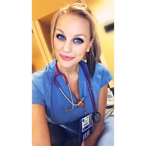 A Woman With Blue Eyes And A Stethoscope Around Her Neck