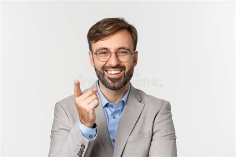 Close Up Of Handsome Businessman With Beard Wearing Gray Suit And Glasses Praising Good Point